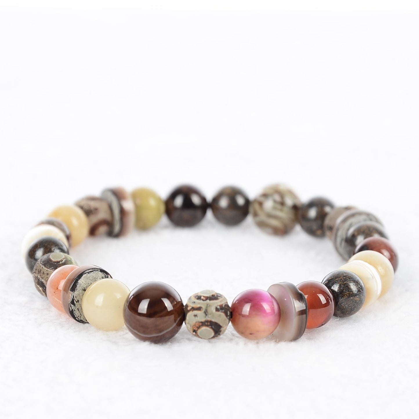 About Last Night bead bracelet is made of earth tones colors with hints of pink  and yellow. Made in a size 7 inch but can be custom made to your size. 