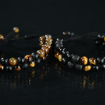Double strand bead bracelet madeof tiger eye, black onyx and black lava. Adjustable for wrist size 7.5-11. Unisex