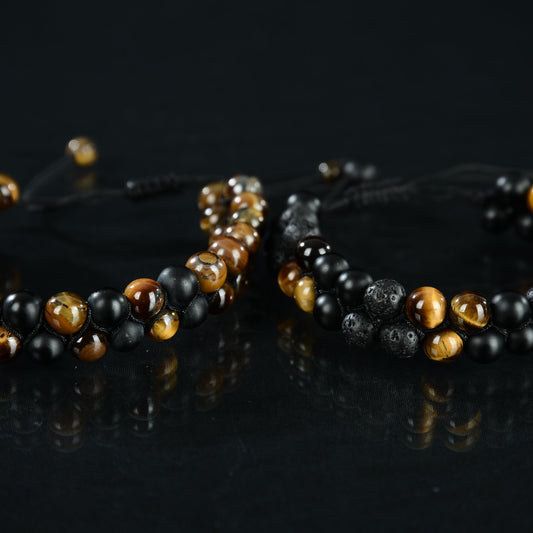 Double strand bead bracelet madeof tiger eye, black onyx and black lava. Adjustable for wrist size 7.5-11. Unisex