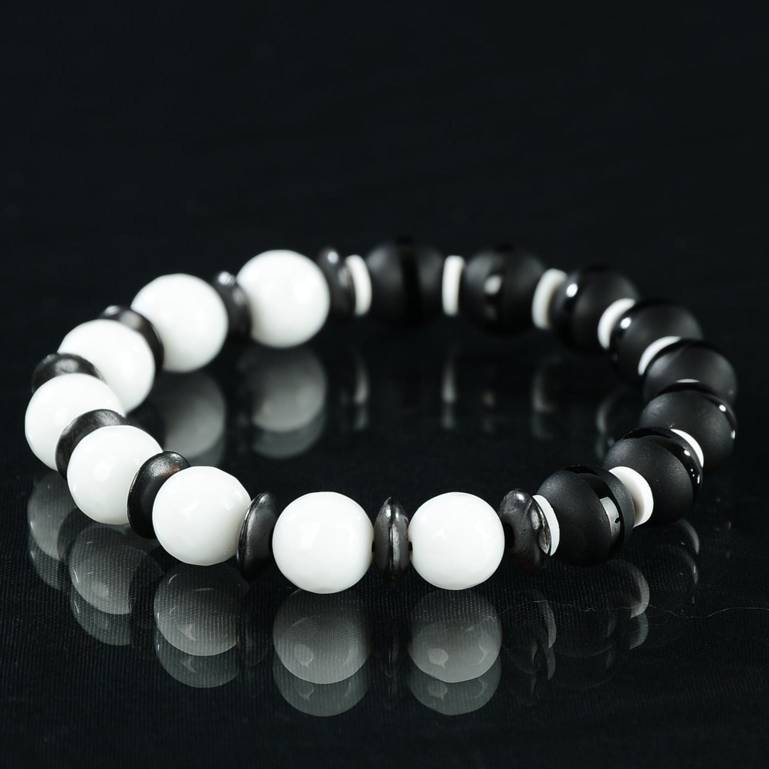 black and white bead bracelet with black spacers. Made to order 