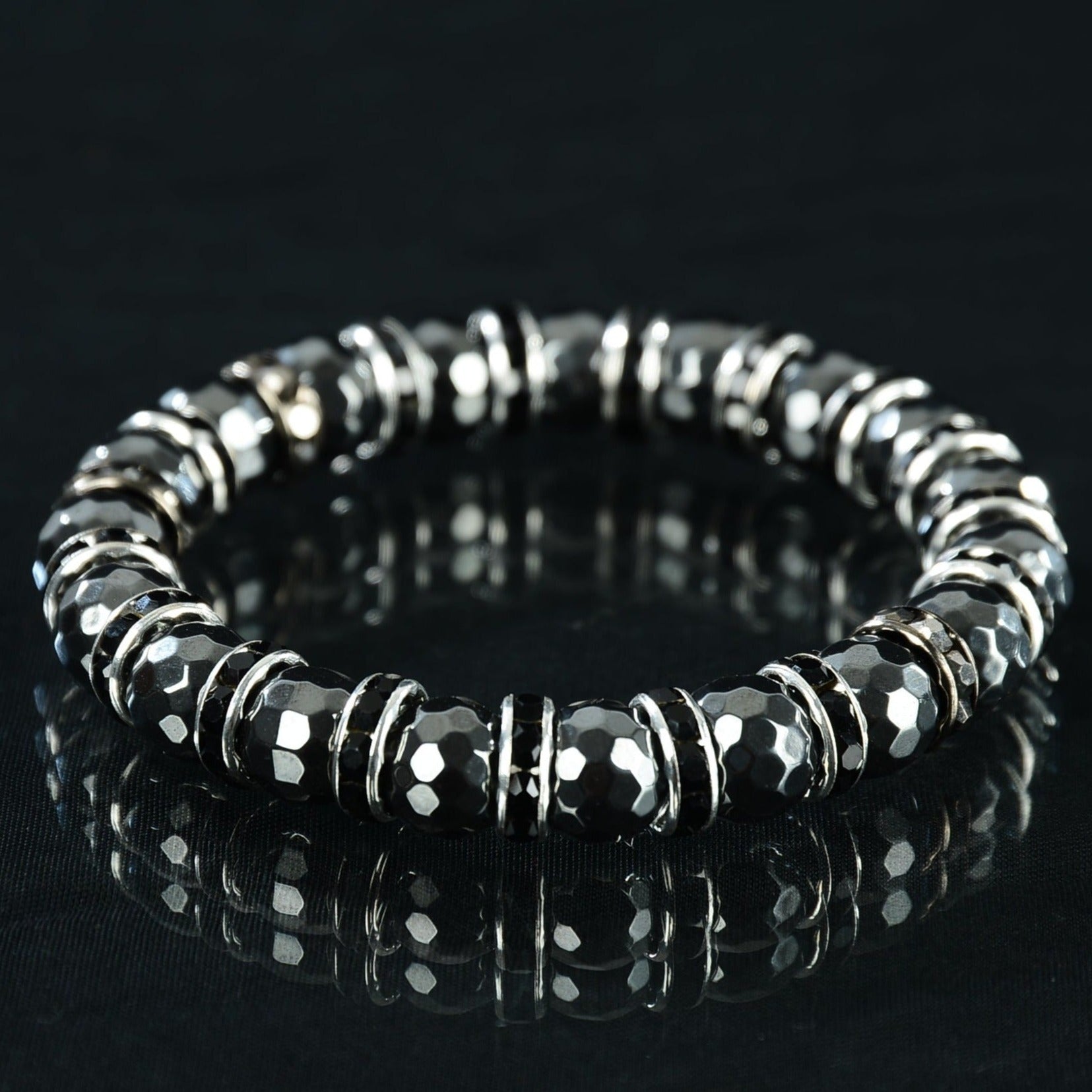 B-Moe... Dark yet the most delicate piece of them all! This hematite bead bracelet is great for maintaining the balance of your energies, chakras, and life by keeping you calm and grounded, regulating the flow of blood, relieving you of stress and anxiety issues, and healing pain while giving you a boost into your creative side.  A guaranteed WINNER! You will NOT be disappointed.